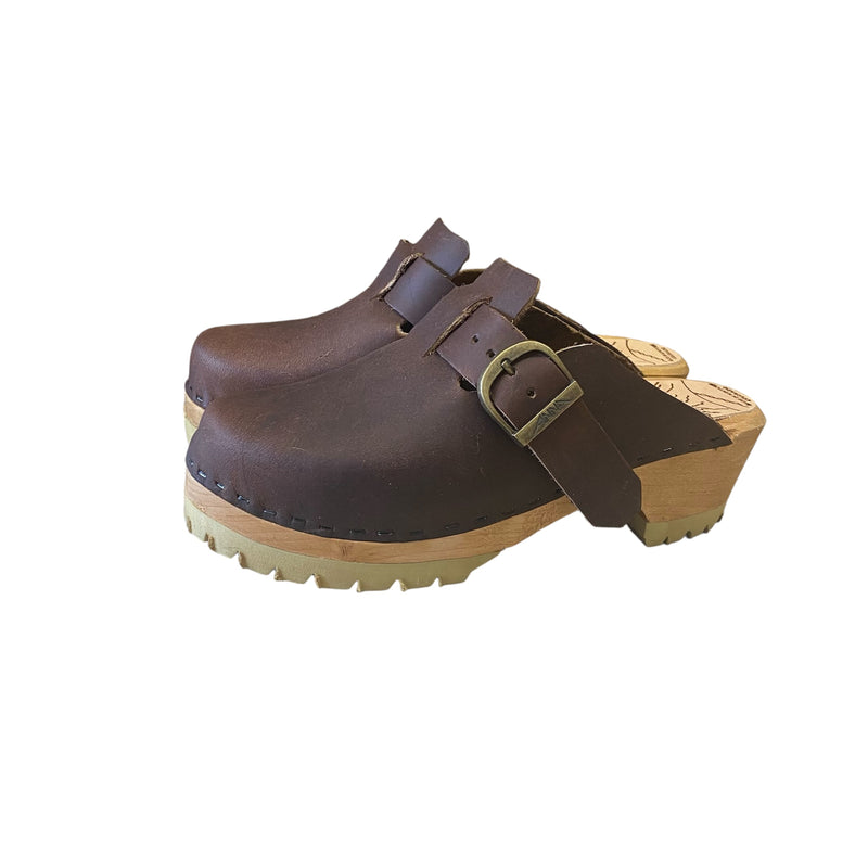 Aspen clog design with an adjustable over the foot strap and mountain sole.