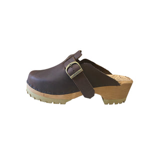 Side view of the Aspen clog design with an adjustable, over the foot strap and mountain sole.