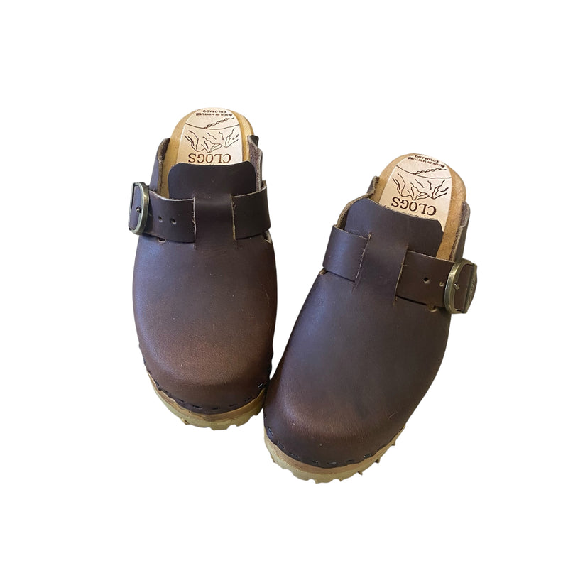 Aspen clog design with an adjustable, over the foot strap and mountain sole.