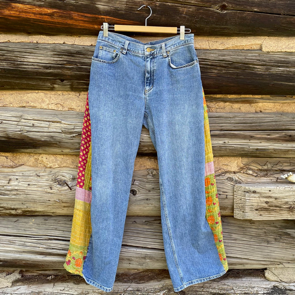 Front of jeans with fabric side panels.