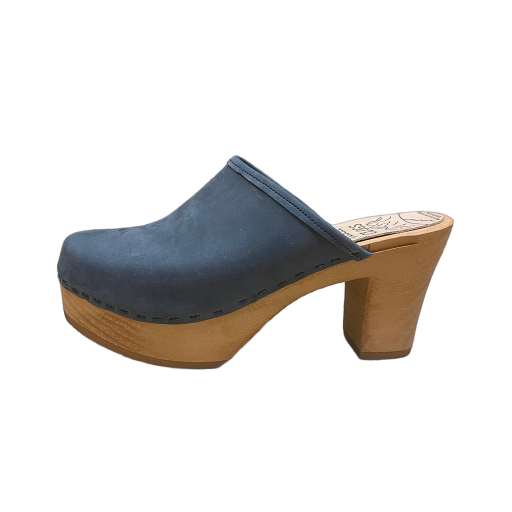 Ultimate High, solid style clog in our blue denim leather with a natural wood stained sole.