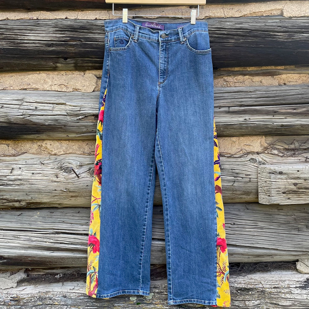 Front of jeans with long, triangular side panels.