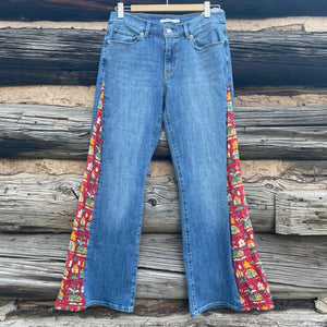 Front of jeans with long triangular inserts using red house fabric.