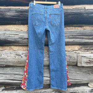 Back of jeans with long triangular inserts using red house fabric.