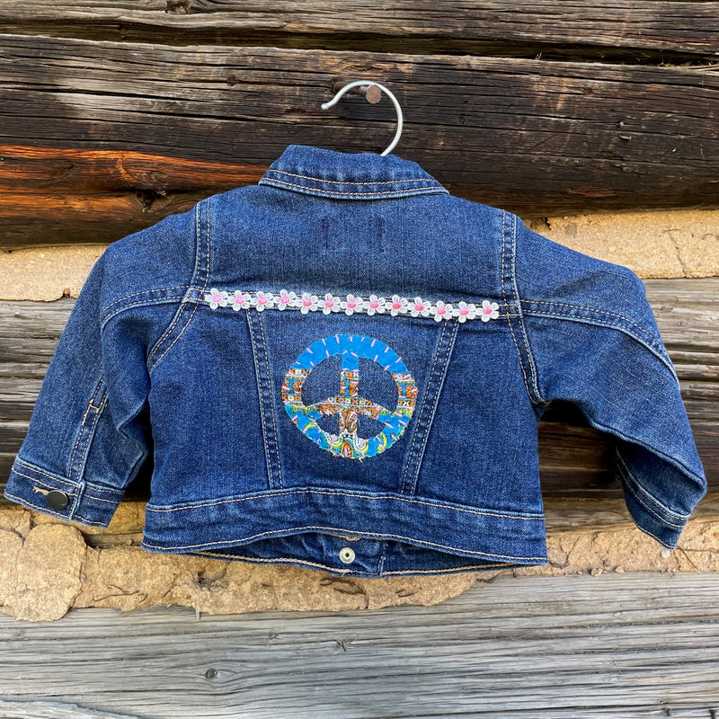 Back of jacket with peace sign patch.