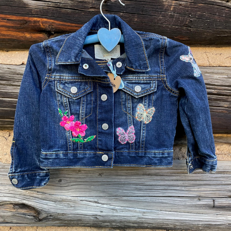 Front of Jean Jacket with flower and butterfly patches.