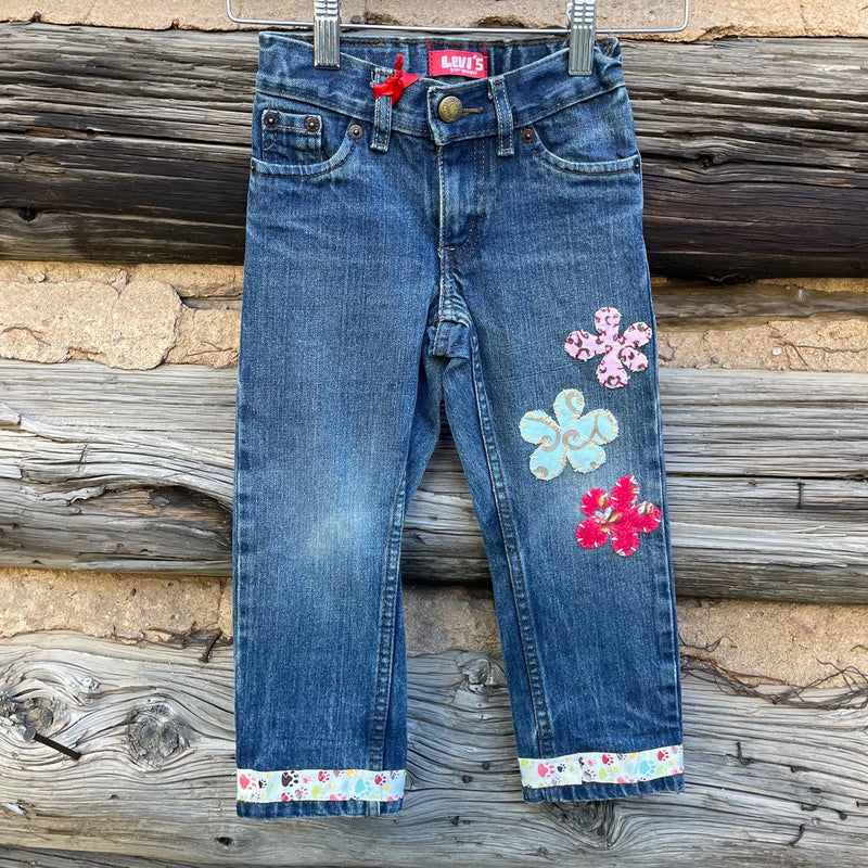 Front of patched flower jeans.