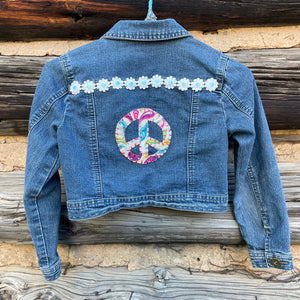 Back of jean jacket with peace sign patch