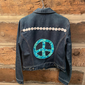 Denim jacket with a peace symbol and floral design 