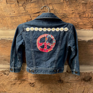 Denim jacket with peace symbol