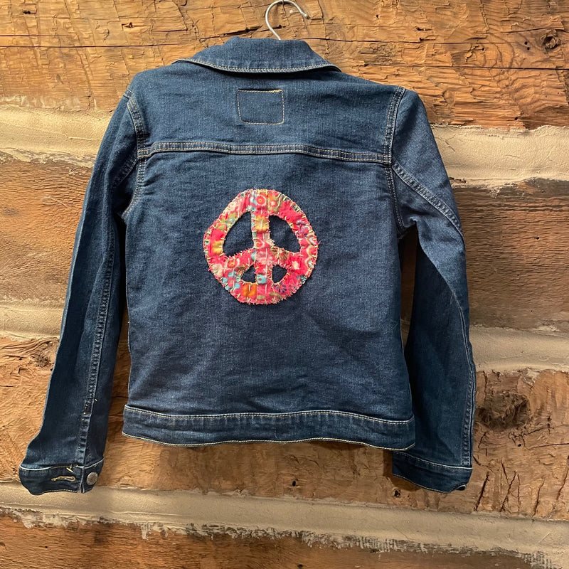 Denim jacket with a colorful peace sign