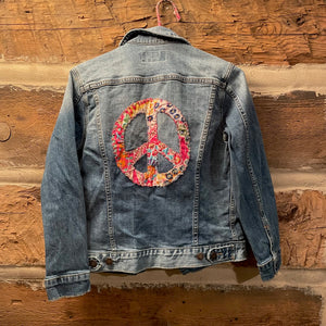 Denim jacket with a colorful peace symbol  patch
