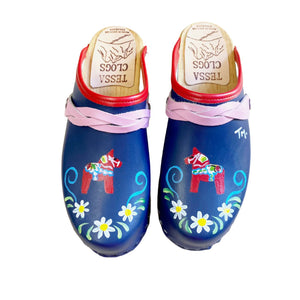 Mountain Sole Clog with blue leather and handpainted Dalahorse design featuring a red edgeband and rose pink braid snap straps