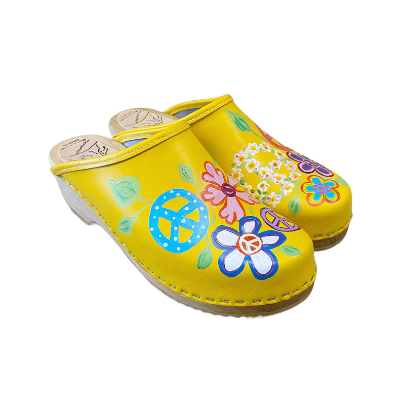 Yellow Christy Peace Design clogs on the traditional heel from the right view