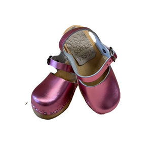 A pair of metallic pink clogs with adjustable straps and wooden soles