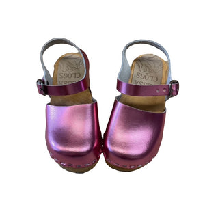 A pair of metallic pink clogs with adjustable straps and wooden soles