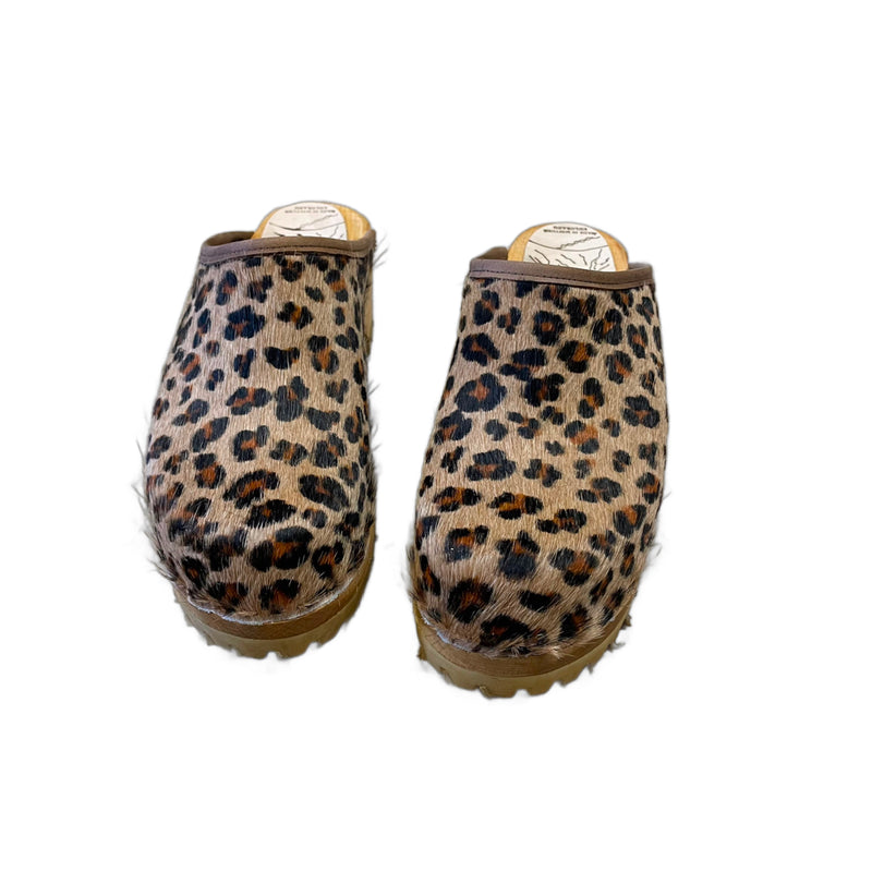 Mountain sole leopard pony Tessa clogs with a natural stain sole and brown edge band.