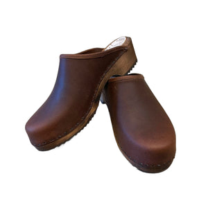 Traditional heel Tessa clog in our featured cocoa bean leather on a brown stain wood sole with a brown edge band and no strap.