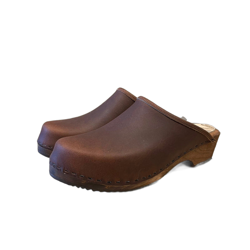 Traditional heel Tessa clog in our featured cocoa bean leather on a brown stain wood sole with a brown edge band and no strap.