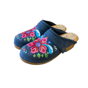 Traditional heel Tessa clog in denim blue leather and natural wood stained soles with the hand painted Petra design and a plain denim blue snap strap.