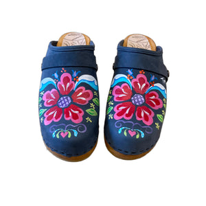 Traditional heel Tessa clog in denim blue leather and natural wood stained soles with the hand painted Petra design and a plain denim blue snap strap.