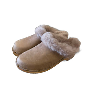 Traditional heel Tessa clogs in Tobacco oil tanned leather with Taupe shearling insole and edge band as well as decorative nails along base of shoe.