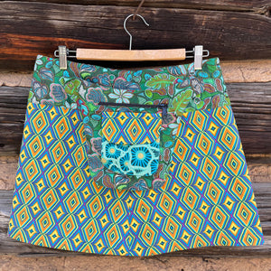 Asha Reversible Wrap Skirt in blue and yellow diamond printed fabric side A.