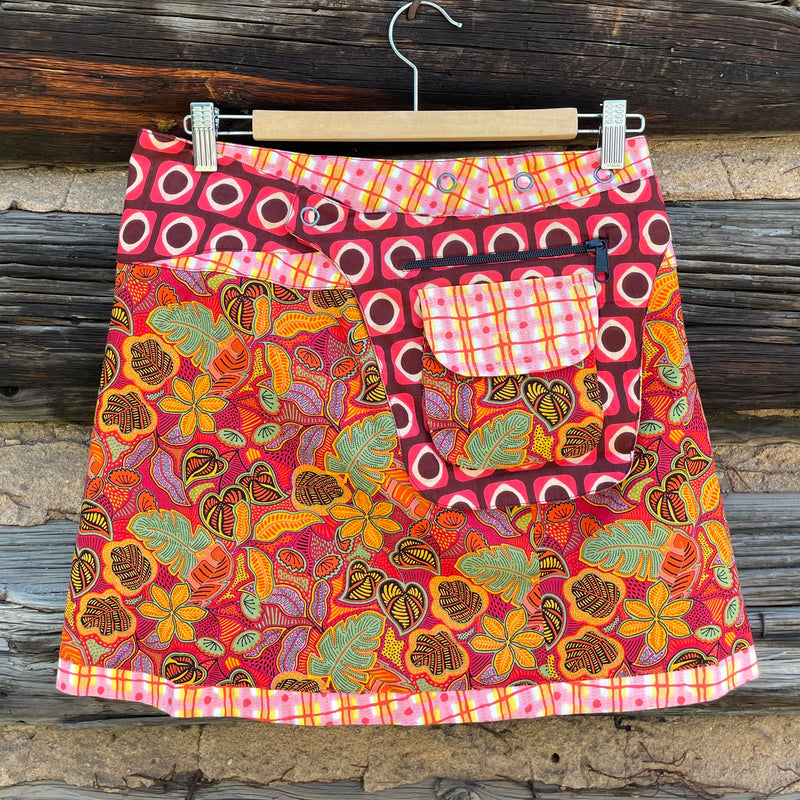 Asha Reversible Wrap skirt side B with orange, yellow and pink printed fabric.