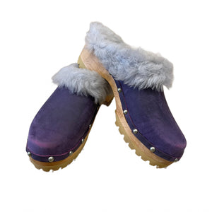 purple clogs with light blue fur shearling on edge band and silver nails.