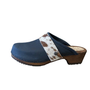 Blue clog shoe with cowhide strap on a white background