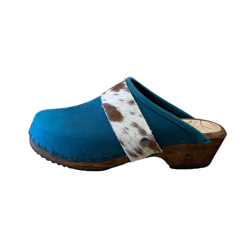 Pacific blue clog with cowhide strap on a white background