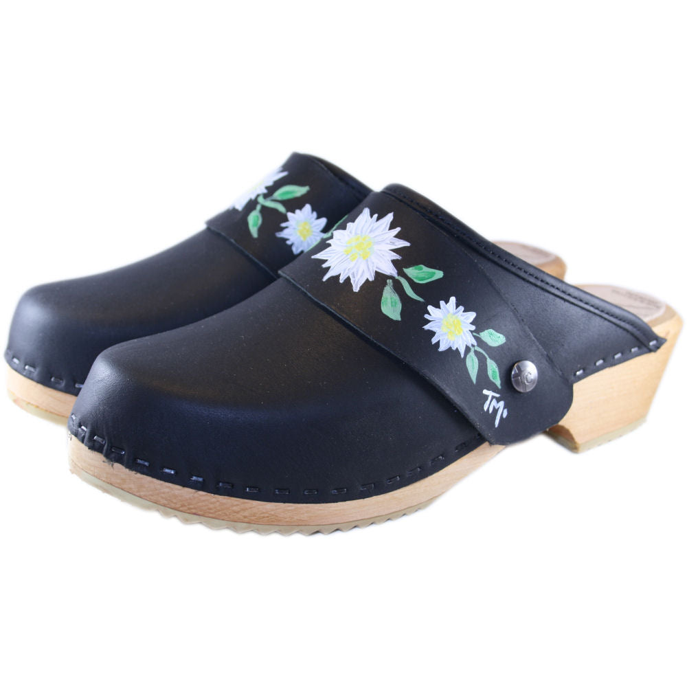 Black traditional heel clogs with hand painted Edelweiss snap strap