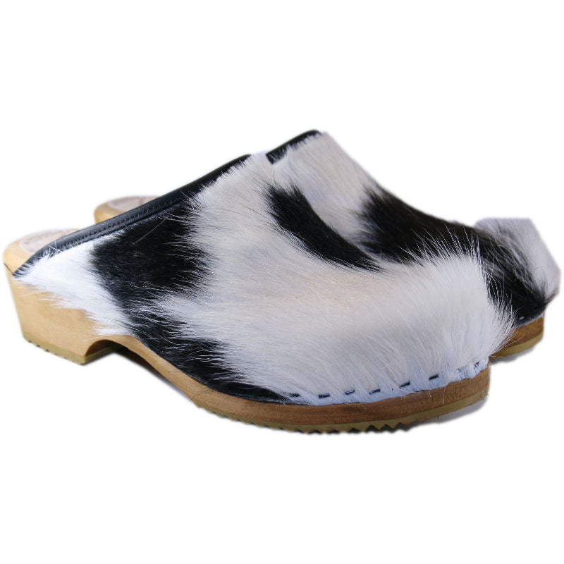 Black and White Traditional Heel Furry Cow clogs natural stained sole