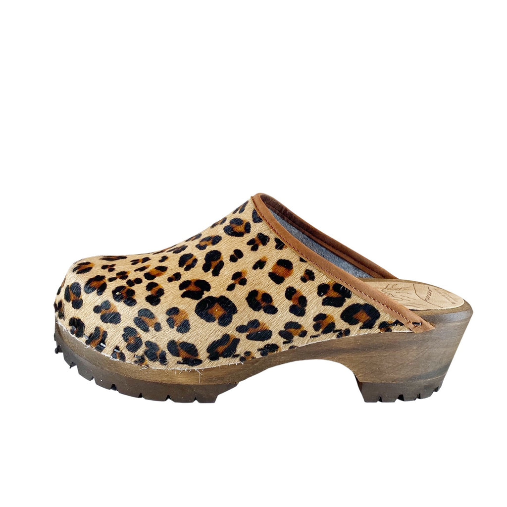 Leopard Mountain Clogs with a taupe leather edge band and brown stained soles.