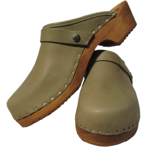 a pair of sage green clogs, green clogs, traditional heel clogs