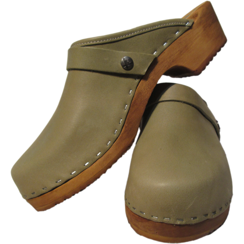 a pair of sage green clogs, green clogs, traditional heel clogs